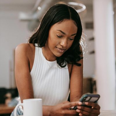 Black Woman Booking on phone 1